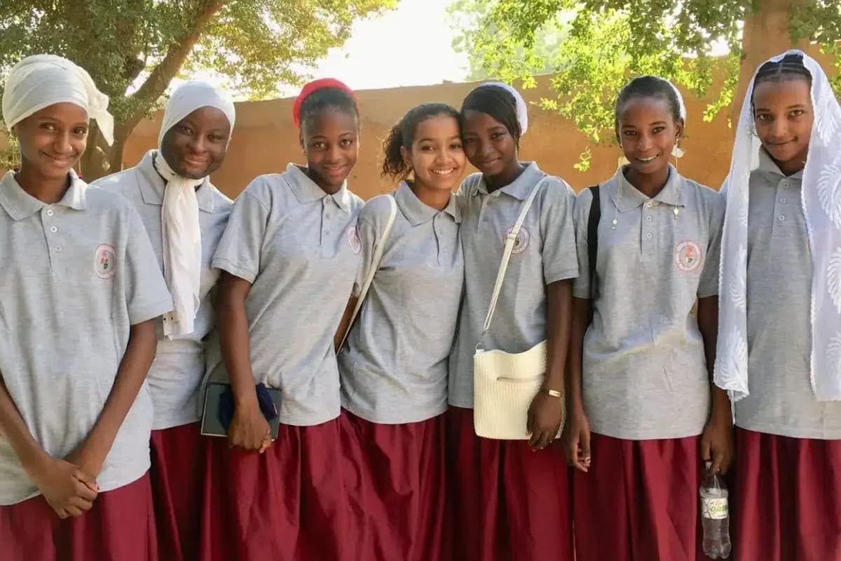 Students and a visitor at Grace Academie in Niger